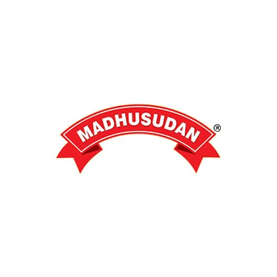 "Madhusudan logo featuring the brand name in bold white capital letters on a curved red ribbon banner with pointed ends. The logo includes a small registered trademark symbol (®) on the upper right side, set against a white background."