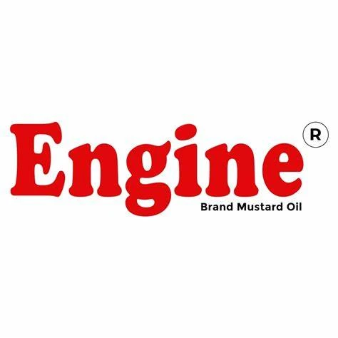 "Engine Brand logo featuring a stylized black and white steam locomotive coming forward on train tracks, with smoke billowing from its chimney. The circular emblem includes text in Hindi, Urdu, and English around the train image, with 'Regd. Trade Mark' w